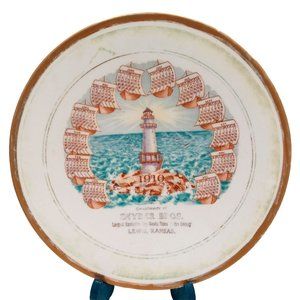 Antique 1910 Calendar Plate Lighthouse Lewis Kansas Snyder Brothers Dry Goods